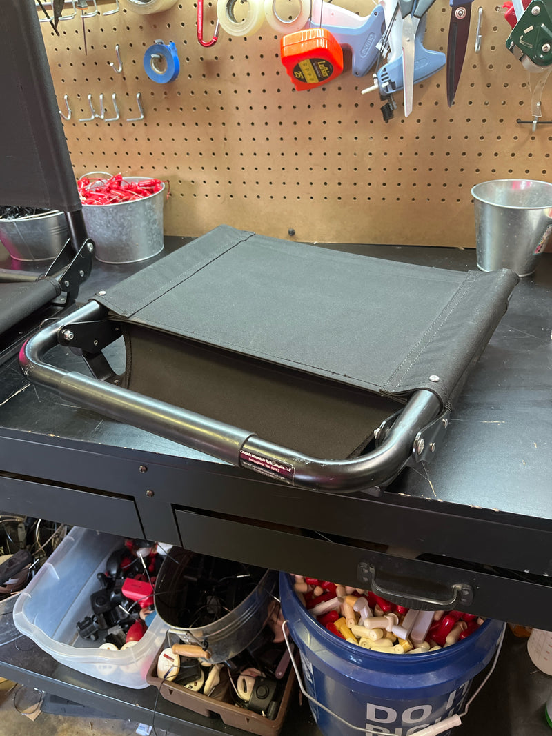 Load image into Gallery viewer, used black folding stadium chair
