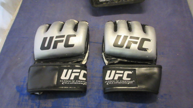 Load image into Gallery viewer, Used The Ultimate UFC MMA Gloves Size Large - heavily worn
