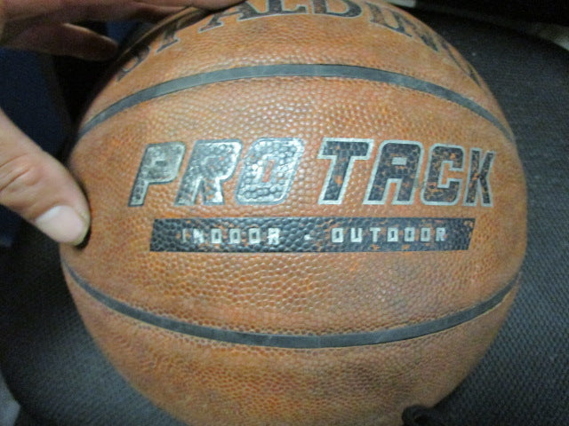 Load image into Gallery viewer, Used Spalding Pro Track Indoor Outdoor Size 7 Basketball
