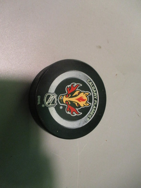 Load image into Gallery viewer, Used Calgary Flames Official NHL Puck
