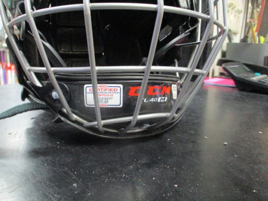 Used CCM Fitlite 40 black hockey helmet with matching face cage