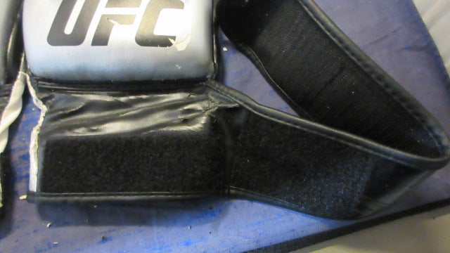 Load image into Gallery viewer, Used The Ultimate UFC MMA Gloves Size Large - heavily worn
