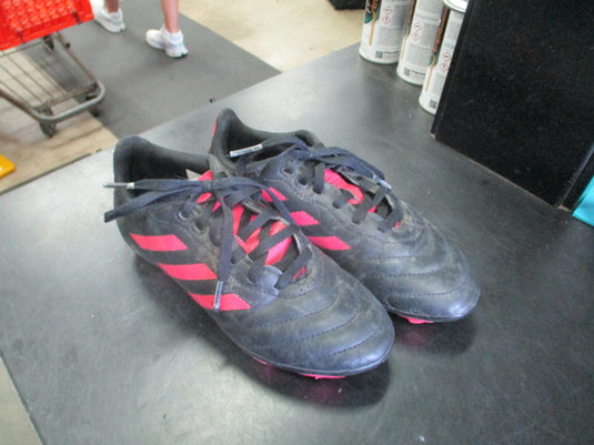 Used Adidas cleats in pink and black size 1.5