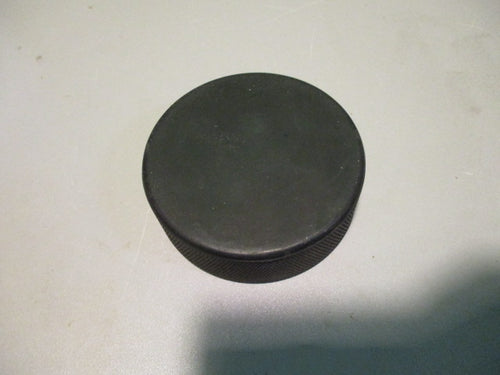 Used Black Hockey Puck