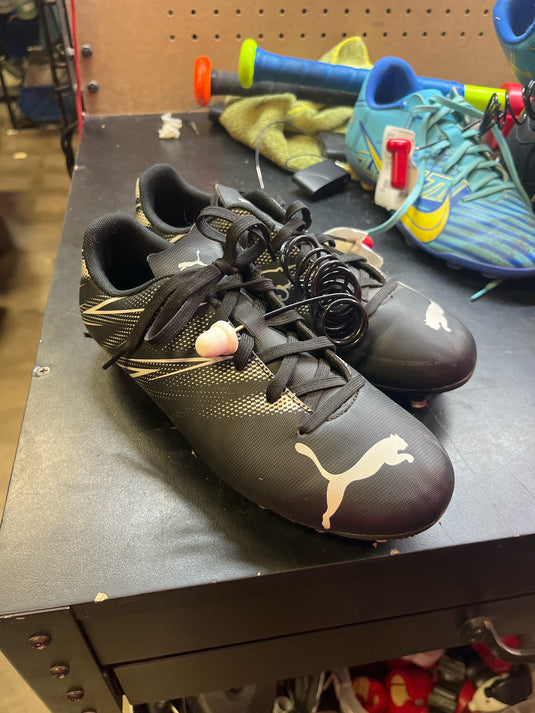 Used puma black and white soccer cleats size 4.5