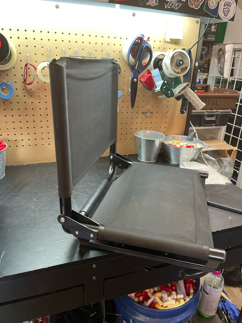 Load image into Gallery viewer, used black folding stadium chair
