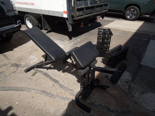 Used Unbranded Adjustable Bench with Leg Ext. Additional parts behind front desk