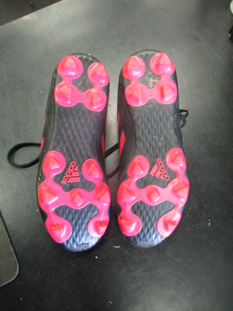 Used Adidas cleats in pink and black size 1.5
