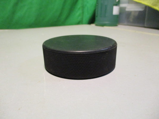Used Black Hockey Puck