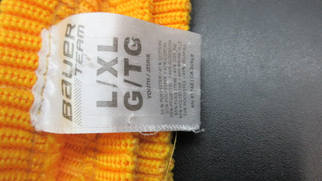 Load image into Gallery viewer, Used Bauer Team Yellow Hockey Socks Youth Size L/XL - holes
