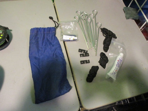 Used Blue Bag of  Tent Stakes Seam Sealant rope and Adjusters