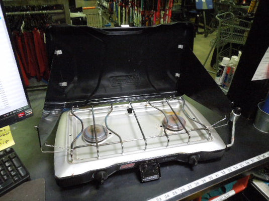 Used Coleman Triton 2 Burner Propane Camping Stove with Wind Shades
