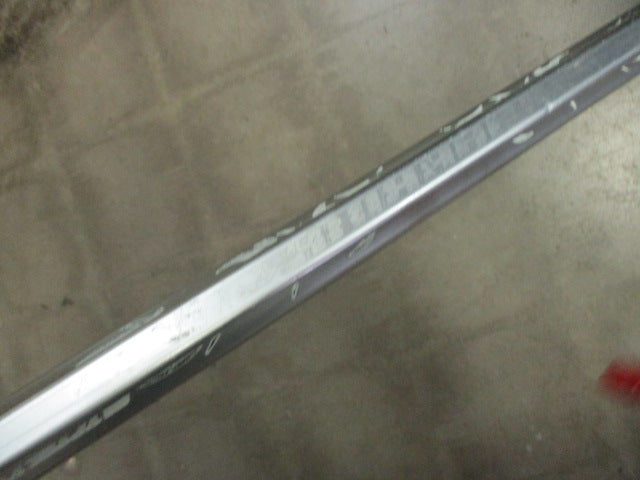 Load image into Gallery viewer, Used Defensive Lacrosse Stck STX Head Warrior Shaft (Slight Bend in Shaft)
