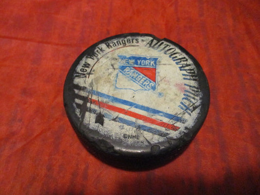Used New York Ranger Autograph NHL Hockey Puck - heavily worn